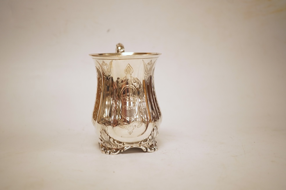 A Victorian engraved silver christening mug, with acanthus leaf capped scroll handle and engraved inscription, Martin, Hall & Co, Sheffield, 1856, 11cm, 5.3oz.